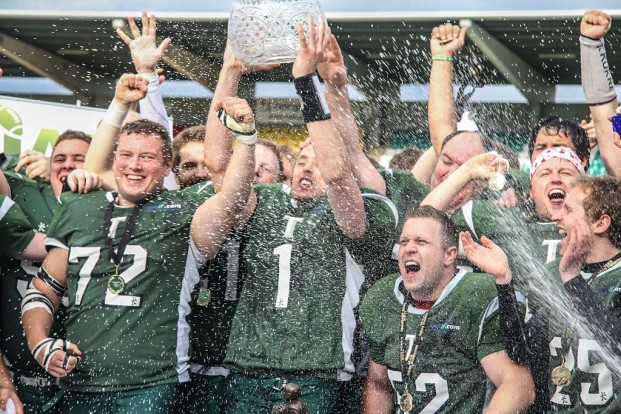 The Belfast Trojans hoist the Shamrock Bowl Trophy as national champions for the first of four times in as many years. No team has ever won five championships in a row.