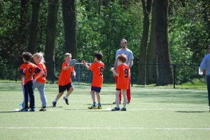 Ilja Tersteeg, founder of the Dominators, teaching flag football to children in Utrecht, Netherlands.